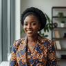 Fatou Ndiaye smiling with braided updo hairstyle